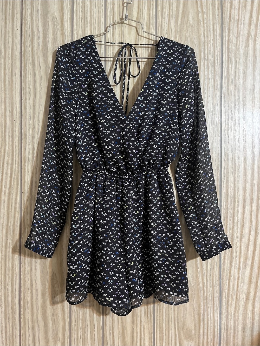 BCBGeneration Black Floral Long-Sleeve Romper with V-Neck